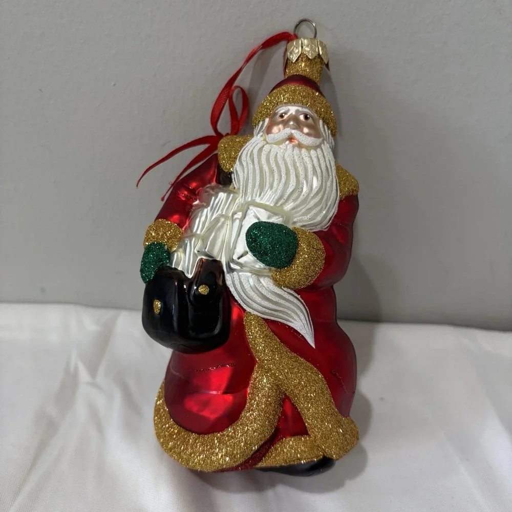 1999 Patricia Breen Through Rain and‎ Snow Santa Ornament Red Coat Bag Glass Vtg